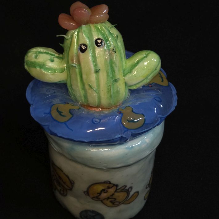 Baby Kaktus mit Schwimmreifen Dekofigur